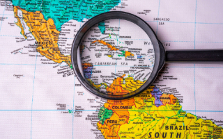 Map with looking glass on Caribbean region